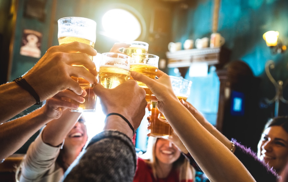 Breweries in Bellingham, photo of friends doing a toast with pints of beer