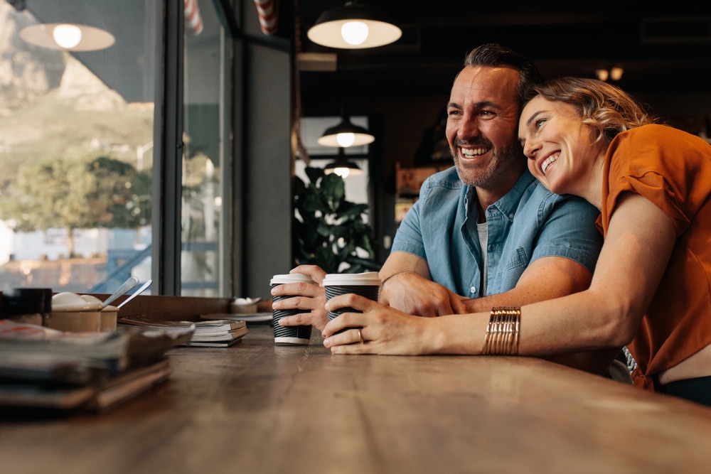 Couple at a coffee shop, one of the best things to do in Bellingham for couples during their romantic getaways in Washington State