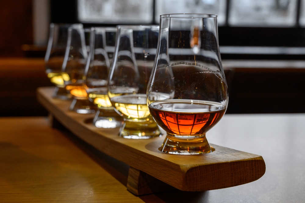 A flight of whiskey spirits like those at Chuckanut Bay Distilling in Bellingham